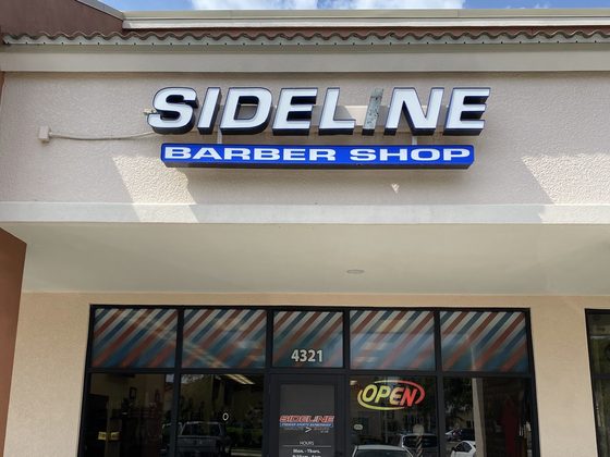 Sideline Barber Shop storefront in North Port, home of Yovany Studio 1